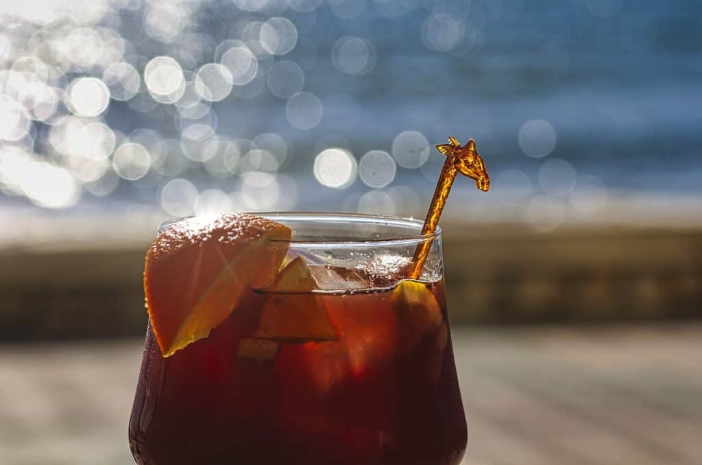 glass of sangria on a beach in barcelona